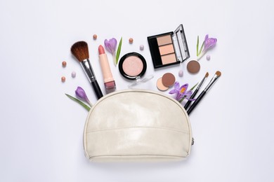 Photo of Flat lay composition with different makeup products and beautiful flowers on white background