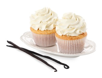 Photo of Tasty cupcakes with cream and vanilla pods isolated on white