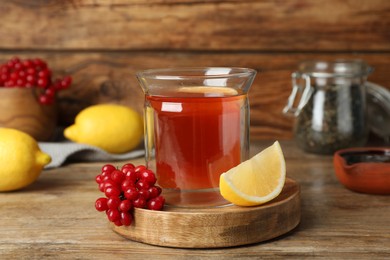 Photo of Immunity boosting drink and ingredients on wooden table