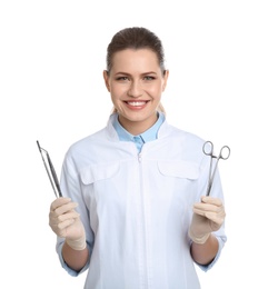 Photo of Female dentist holding professional tools on white background