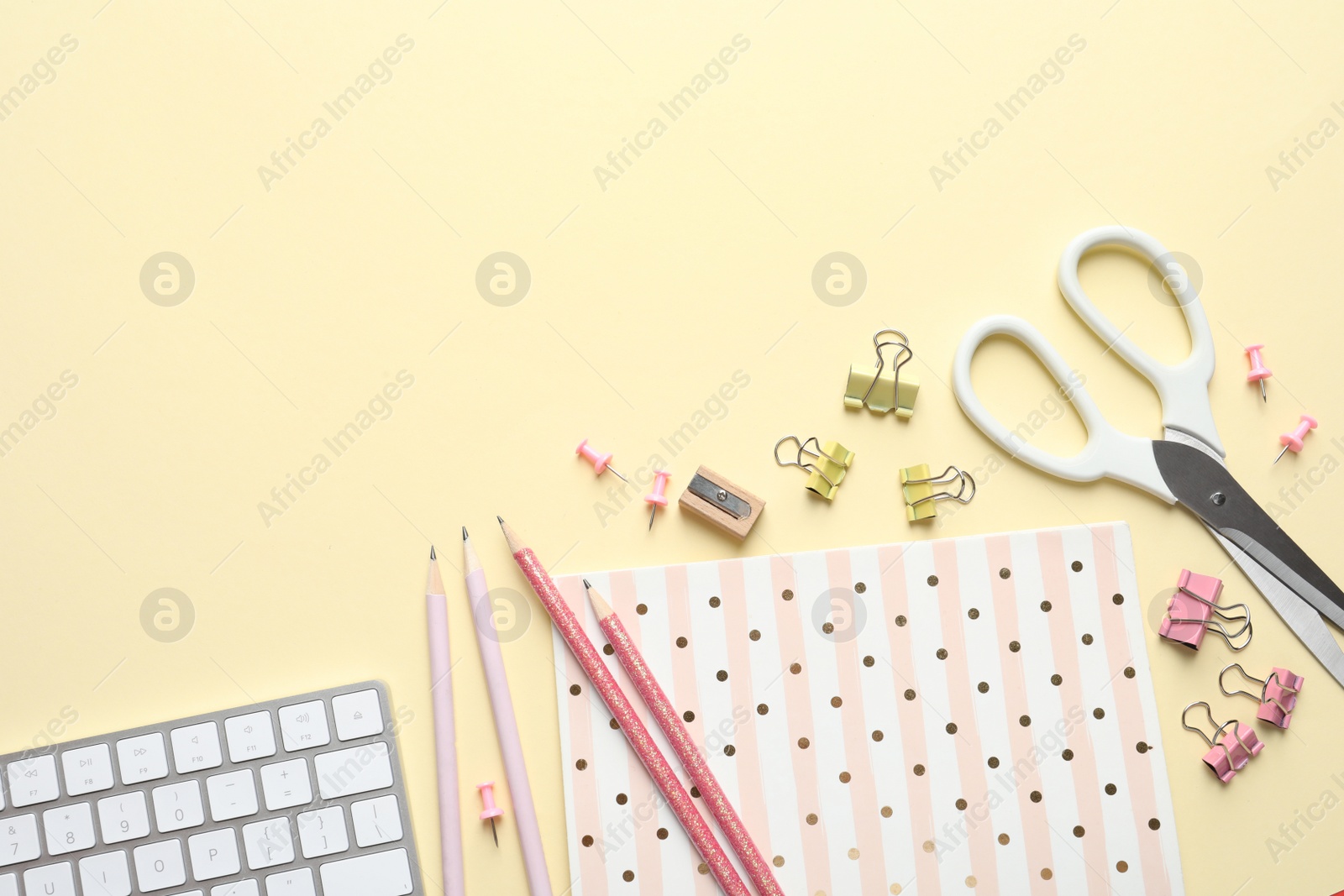 Photo of Flat lay composition with scissors and office supplies on color background. Space for text