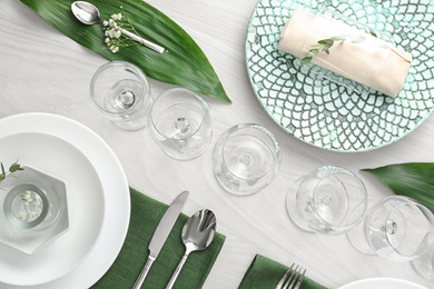 Elegant festive setting on white wooden table, flat lay