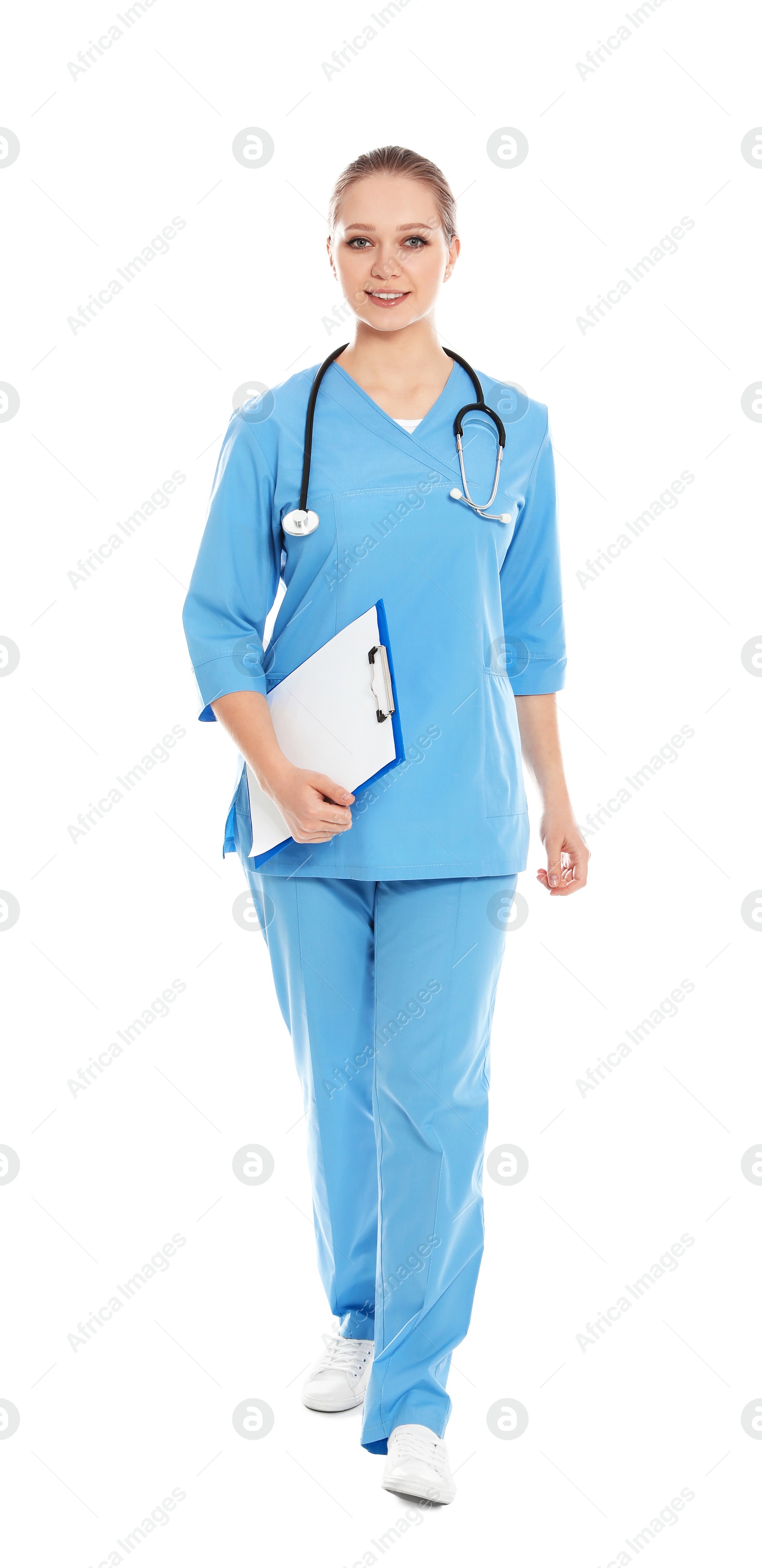 Photo of Full length portrait of medical doctor with clipboard and stethoscope isolated on white