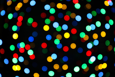 Multicolor blurred lights on black background. Bokeh effect