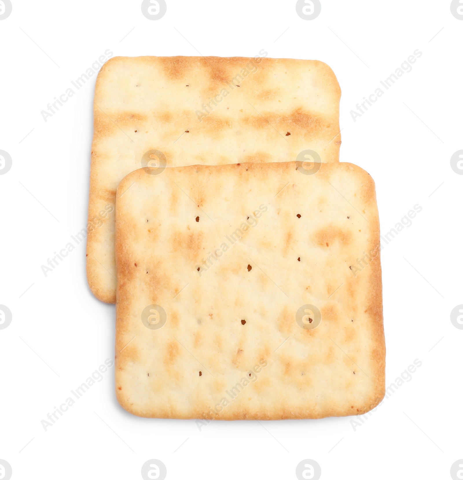 Photo of Tasty crispy square crackers isolated on white, top view