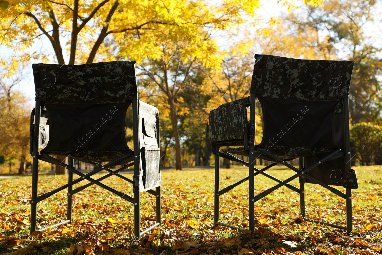 Photo of Pair of camping chairs in park on sunny day