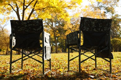 Photo of Pair of camping chairs in park on sunny day
