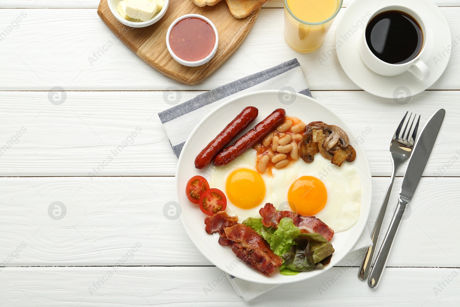 Photo of Delicious breakfast with sunny side up eggs served on white wooden table, flat lay