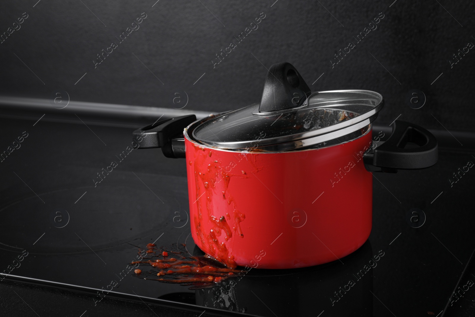 Photo of Dirty pot with lid on cooktop in kitchen, space for text