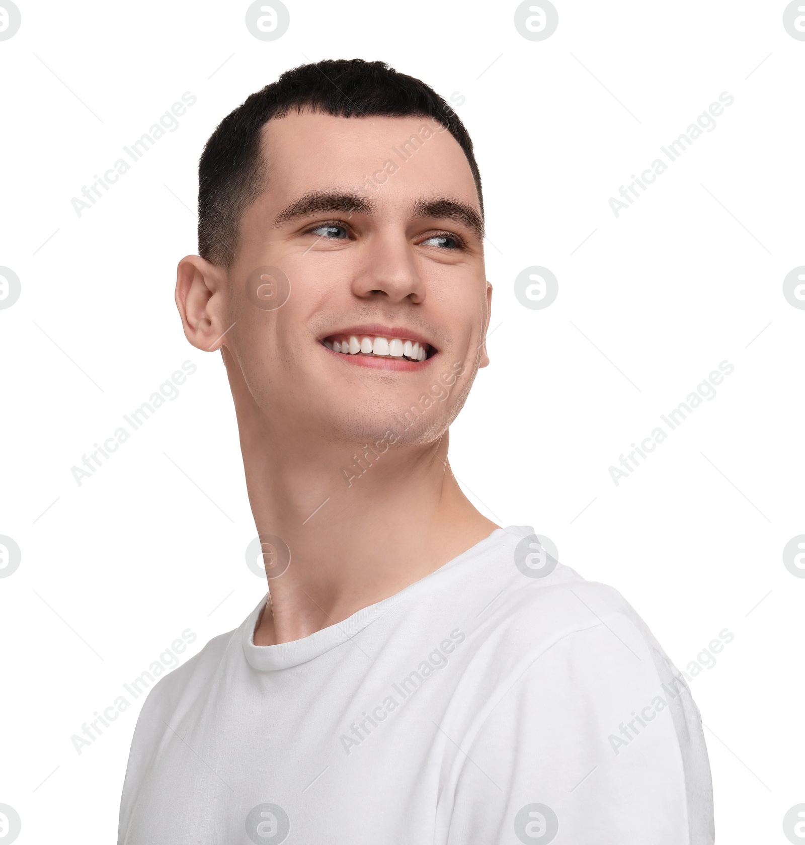 Photo of Handsome young man with clean teeth smiling on white background
