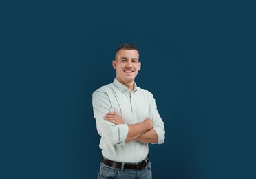 Photo of Portrait of handsome man on blue background