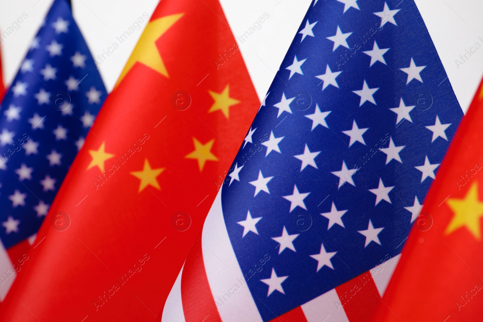 Photo of USA and China flags, closeup. International relations