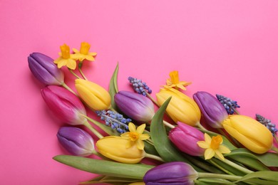 Photo of Beautiful different flowers on pink background, flat lay. Space for text