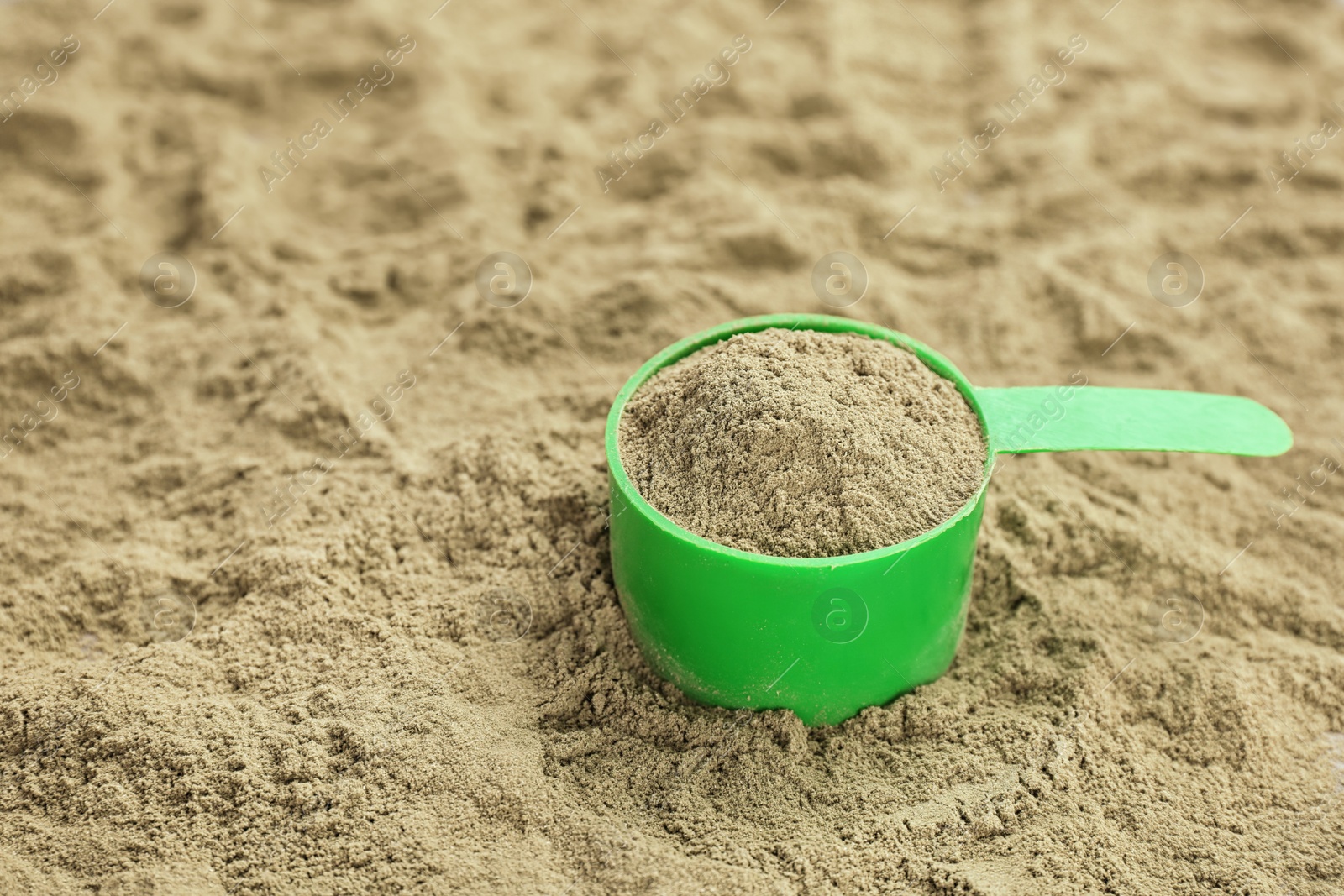 Photo of Measuring spoon and hemp protein powder, closeup. Superfood