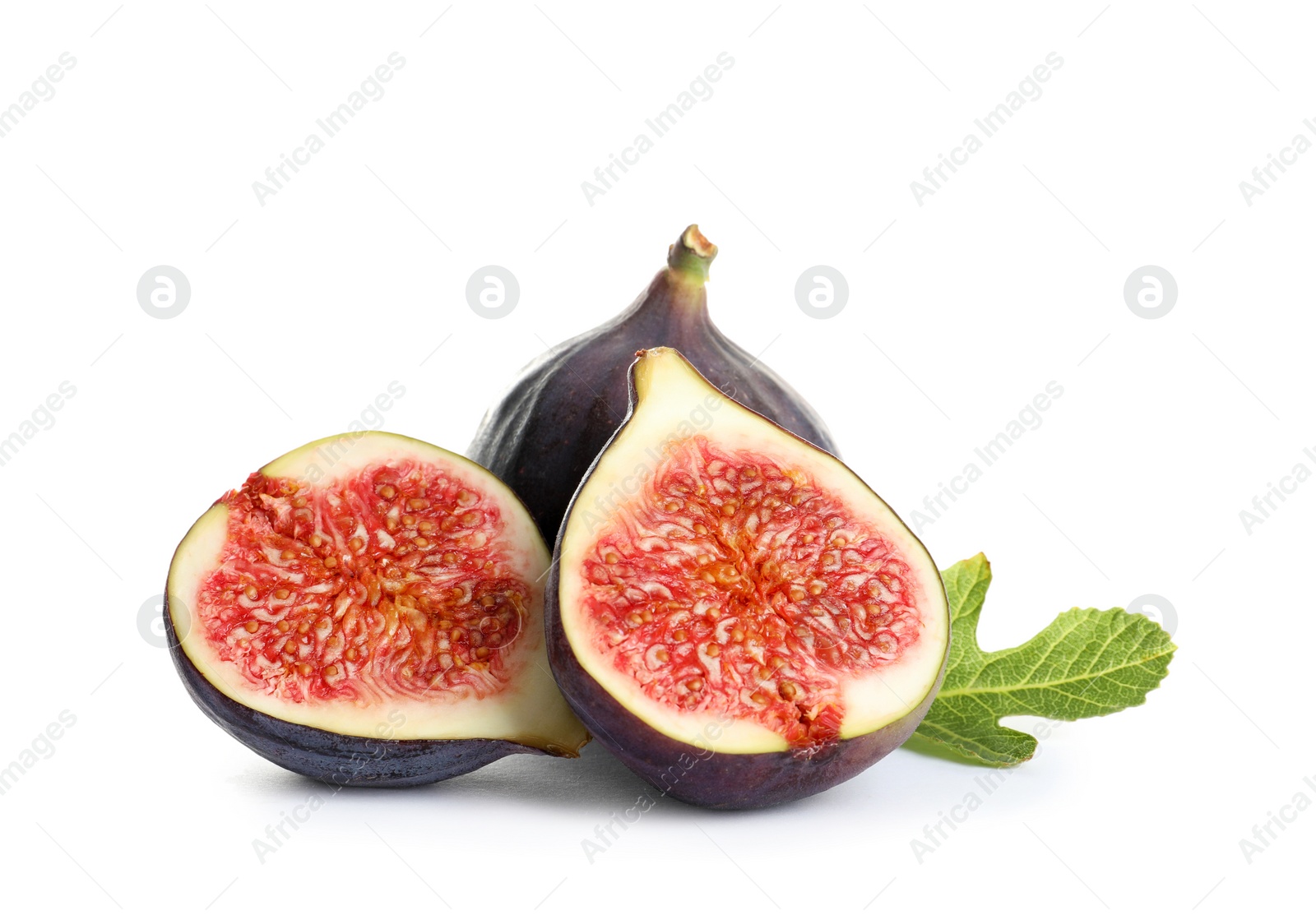 Photo of Whole and cut purple figs on white background