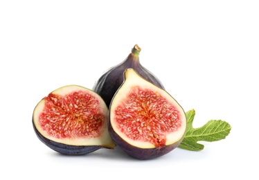 Whole and cut purple figs on white background