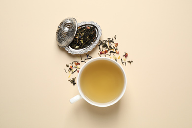Photo of Flat lay composition with green tea on beige background