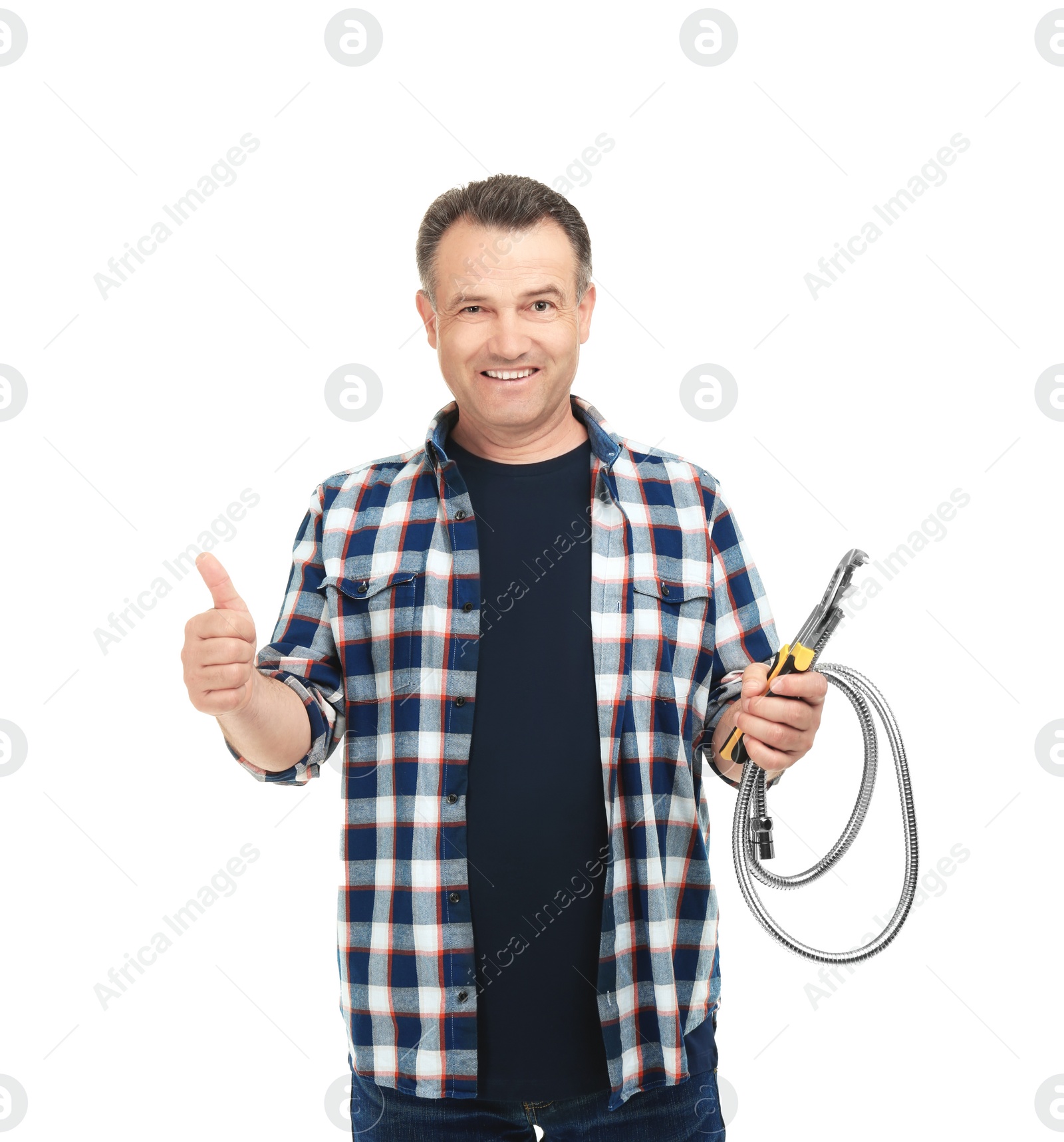 Photo of Mature plumber with hose and adjustable wrench on white background