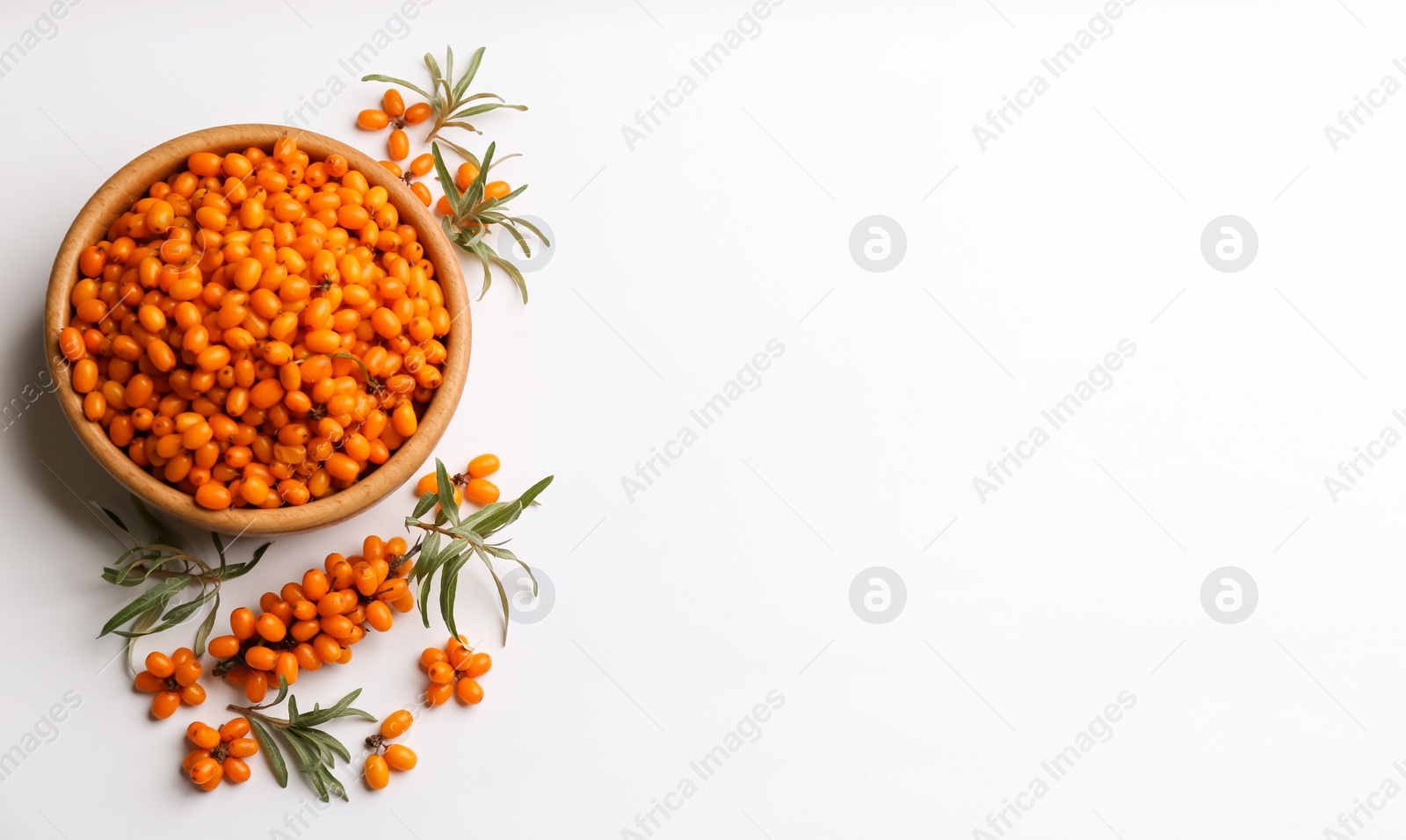 Photo of Fresh ripe sea buckthorn on white background, flat lay. Space for text