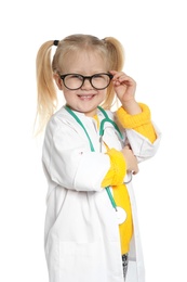 Photo of Cute little child in doctor coat with stethoscope on white background
