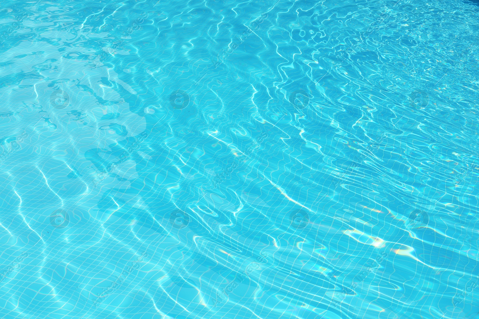 Photo of Clear refreshing water in swimming pool, closeup