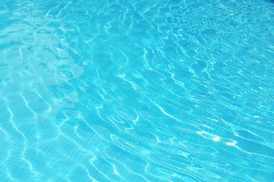 Photo of Clear refreshing water in swimming pool, closeup