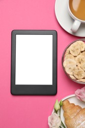 E-book reader with breakfast and flowers on pink background, flat lay. Space for text
