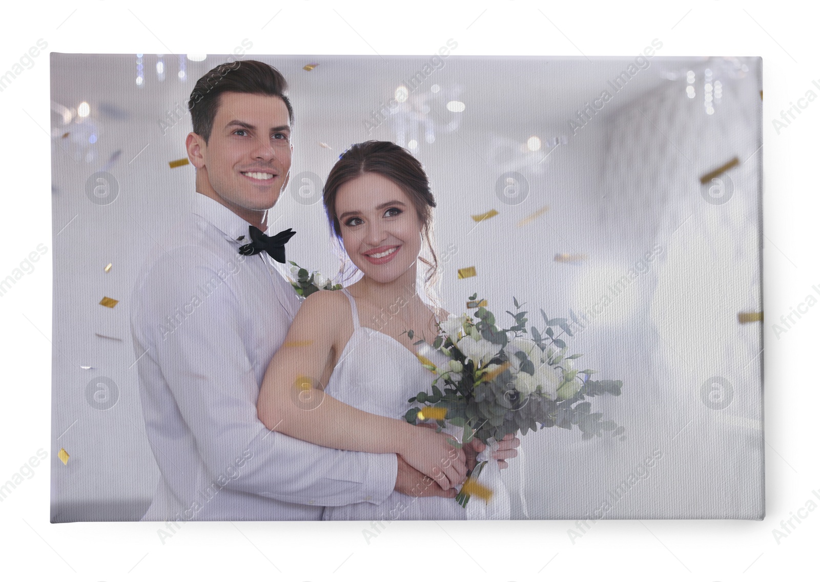 Image of Photo printed on canvas, white background. Happy newlywed couple together in festive hall