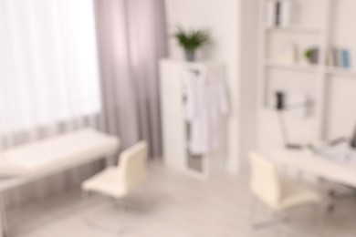 Blurred view of medical office interior with doctor's workplace