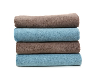 Photo of Stack of clean folded towels on white background