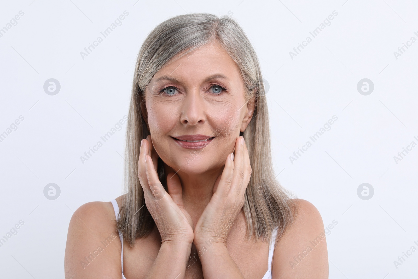 Photo of Portrait of beautiful senior woman on white background