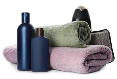 Photo of Personal hygiene products with towels on white background