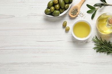 Photo of Flat lay composition with olive oil on white wooden table, flat lay. Space for text