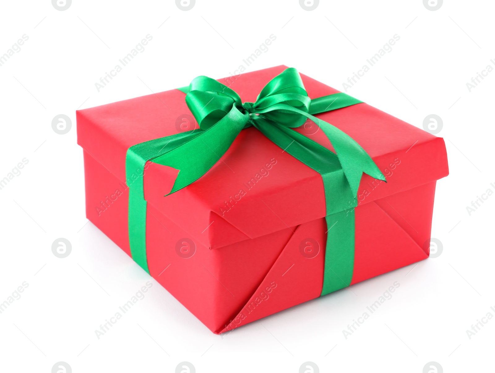 Photo of Christmas gift box decorated with ribbon bow on white background