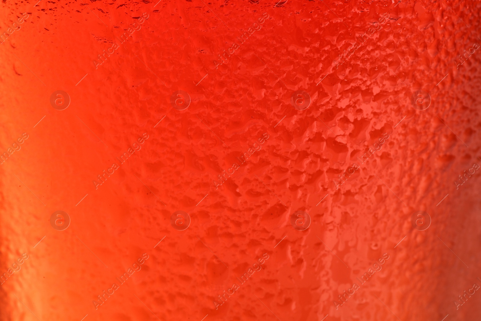 Photo of Glass of tasty red beer, closeup. Alcoholic drink