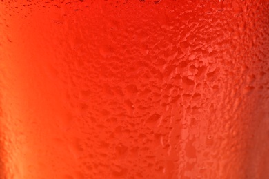 Photo of Glass of tasty red beer, closeup. Alcoholic drink