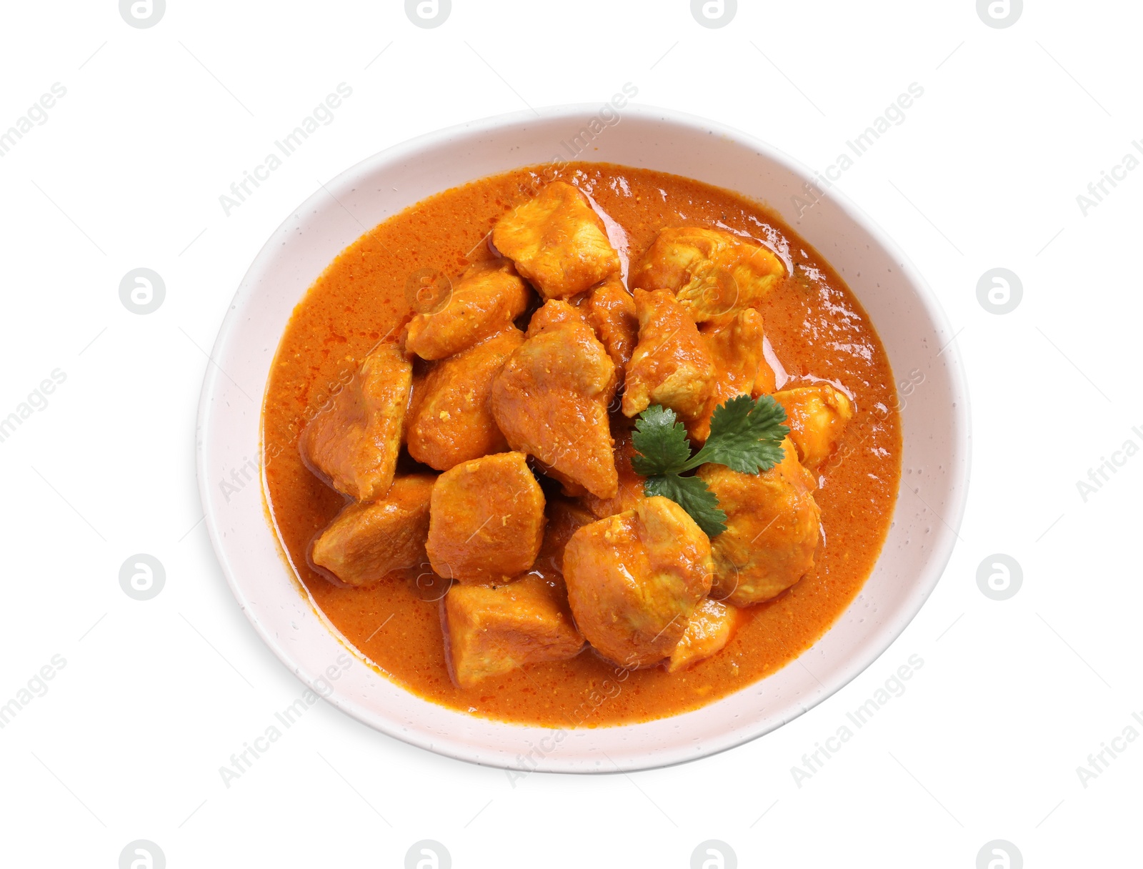 Photo of Bowl of delicious chicken curry on white background, top view