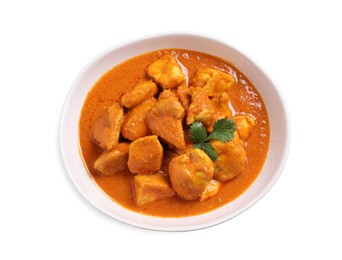 Photo of Bowl of delicious chicken curry on white background, top view