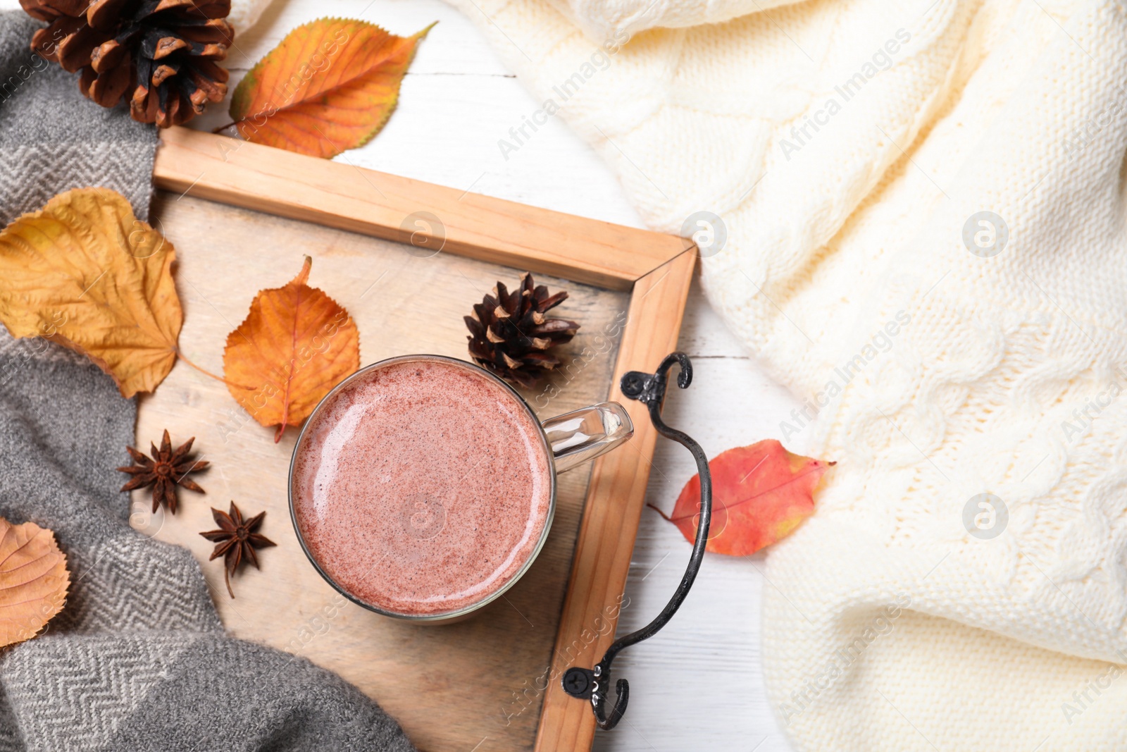 Photo of Flat lay composition with cup of hot drink on white wooden table. Cozy autumn atmosphere