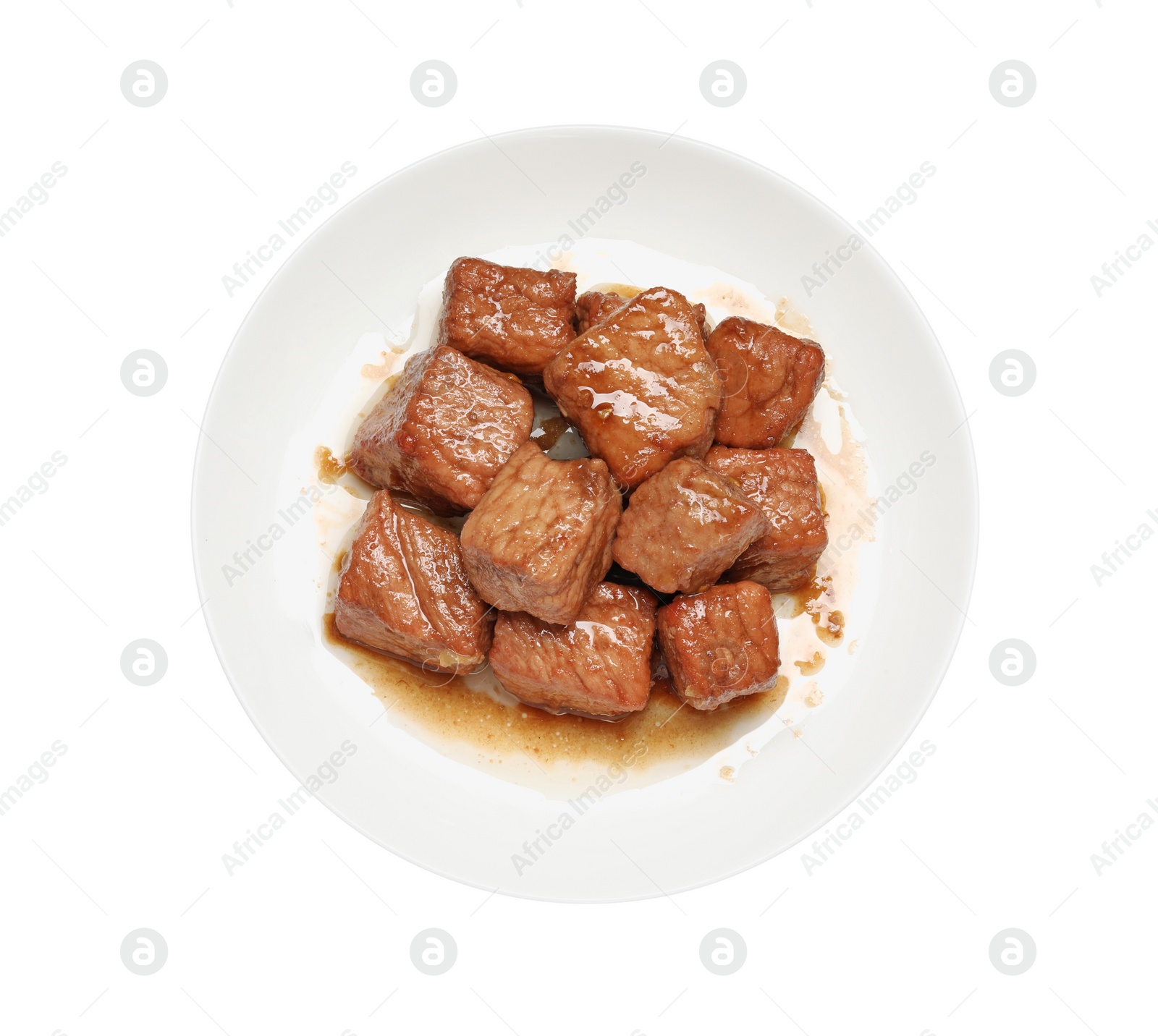 Photo of Plate with delicious cooked beef isolated on white, top view. Tasty goulash