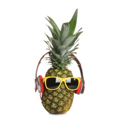 Funny pineapple with headphones and sunglasses on white background