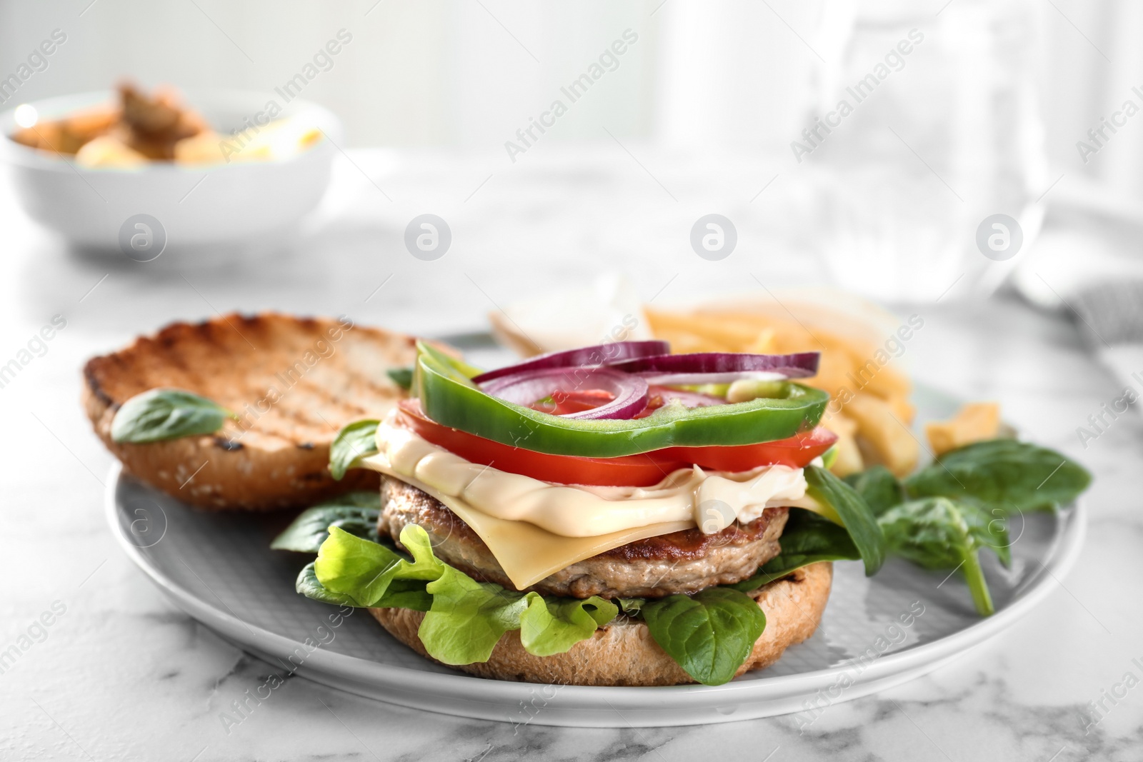 Photo of Plate with tasty burger on table. Space for text