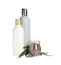Photo of Set of hemp cosmetics with green leaves and seeds isolated on white