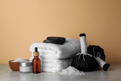 Photo of Composition with different spa products on beige table