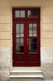 Photo of View of building with wooden door. Exterior design