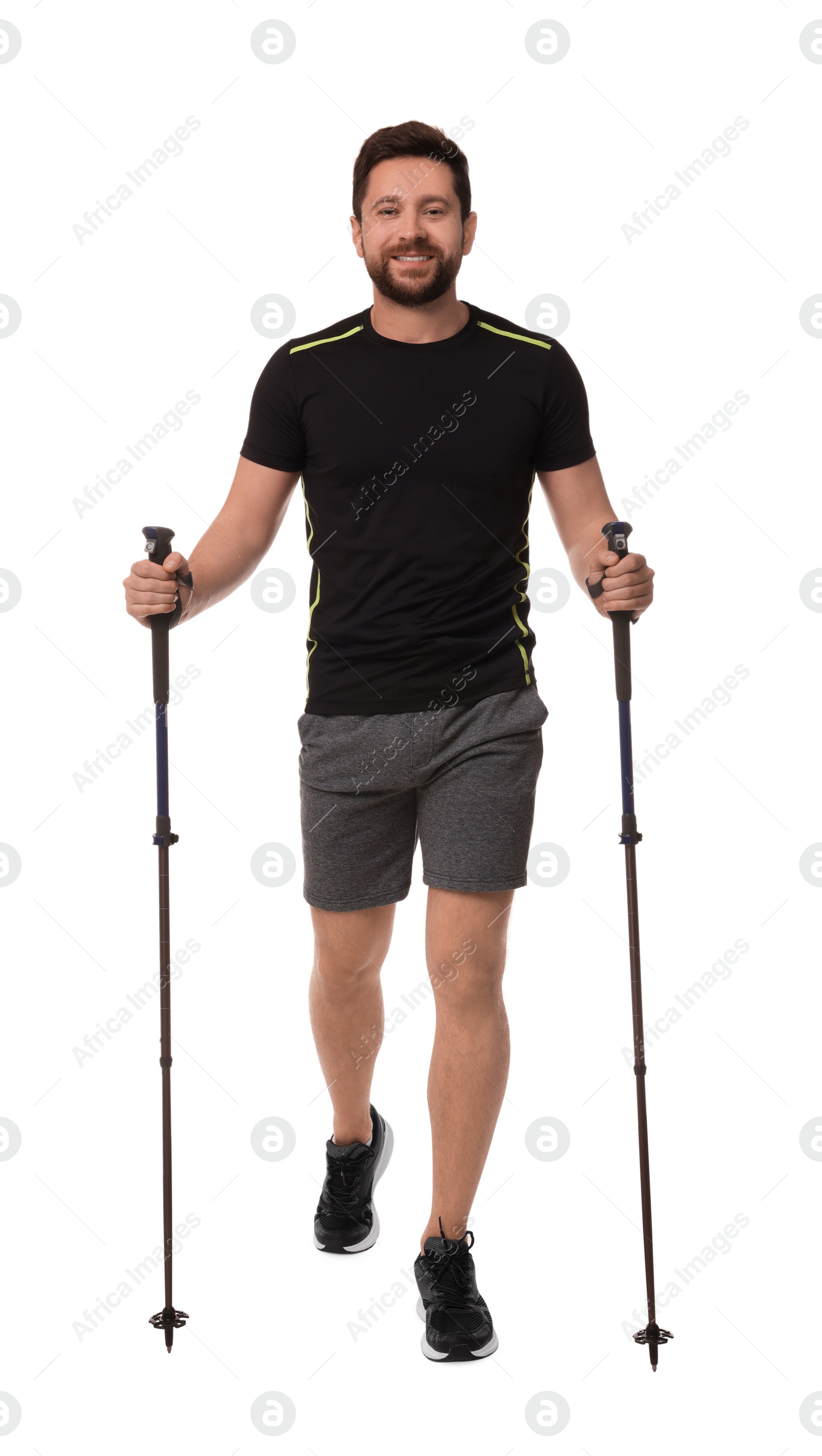 Photo of Man practicing Nordic walking with poles isolated on white