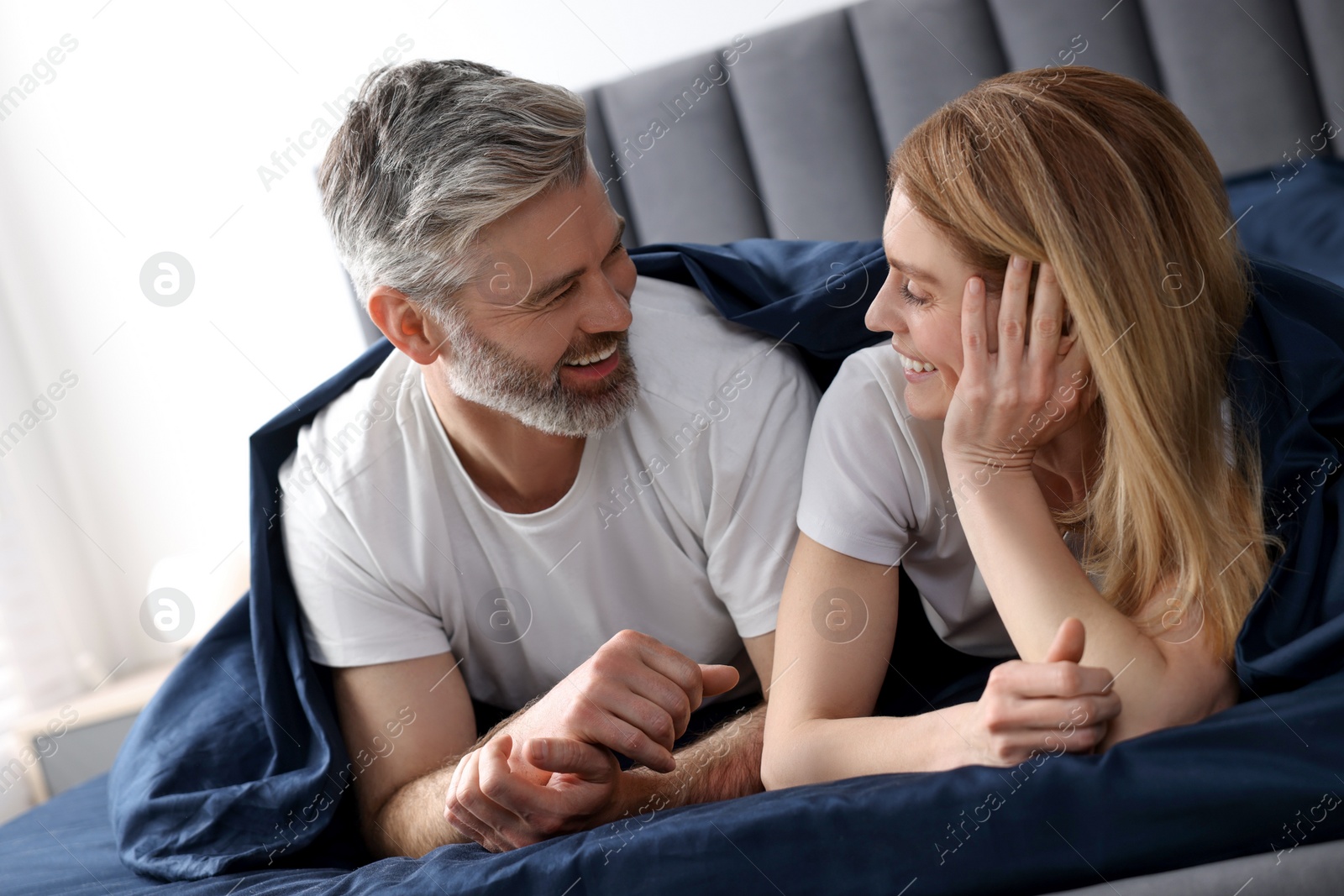 Photo of Lovely mature couple in bed at home