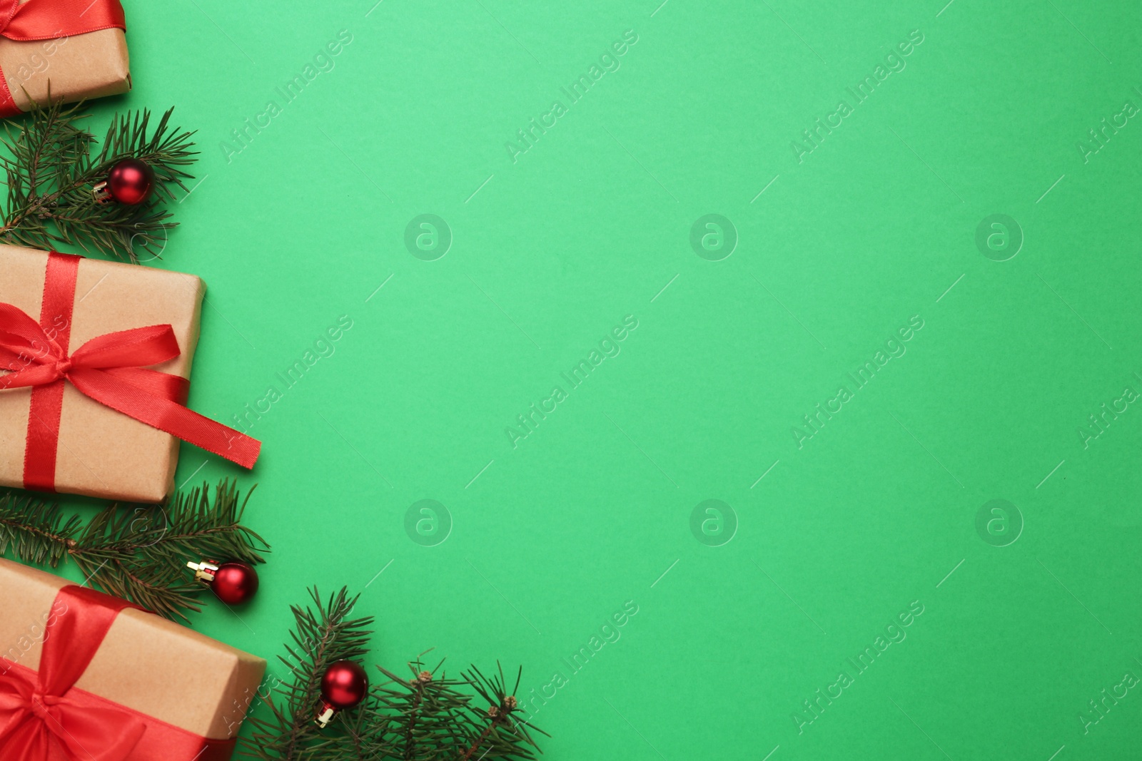 Photo of Flat lay composition with Christmas gifts on green background, space for text. Boxing day