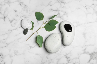 Flat lay composition with spa stones on marble background