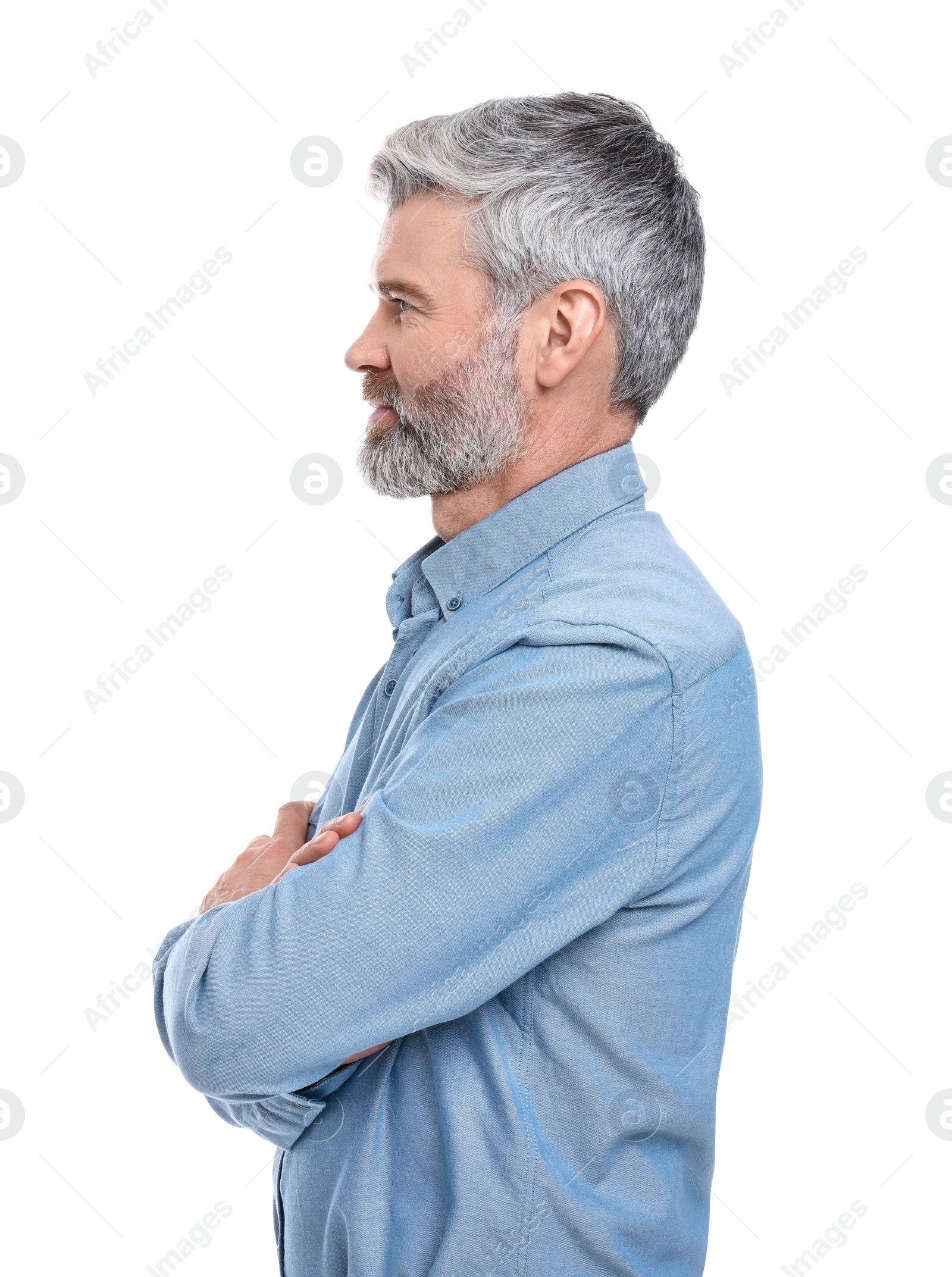 Photo of Mature businessman in stylish clothes posing on white background